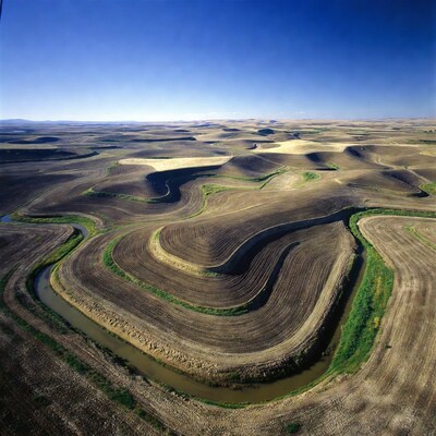 Aerial view of rolling farmlands and river
