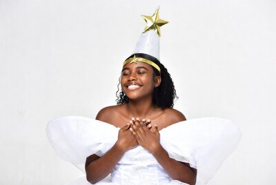 African-American woman in white fairy costume