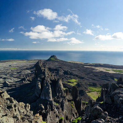 Volcanic Landscape with Sea and Clouds