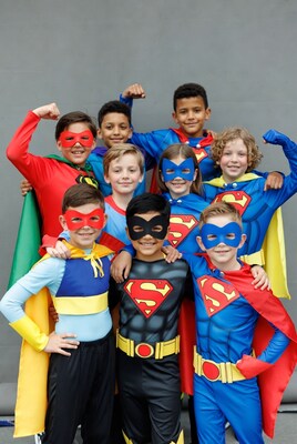 Group of kids in superhero costumes