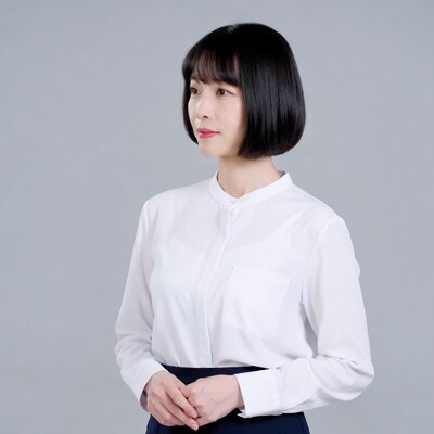 Asian woman in white shirt profile view