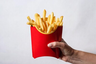 Hand holding McDonald's fries
