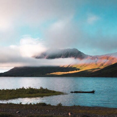 Misty Mountains Over Serene Lake