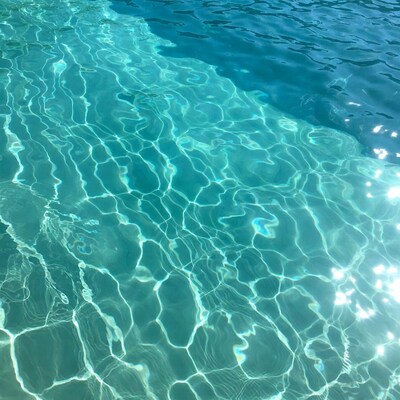Clear turquoise pool water surface