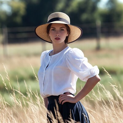 Woman in straw hat in field