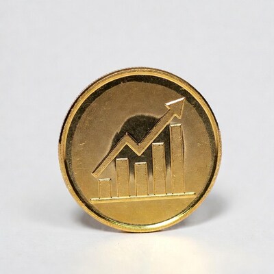 Gold coin with upward graph