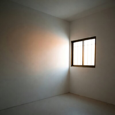 Empty room with sunlight through window