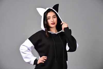 Woman in black and white cat ear hoodie