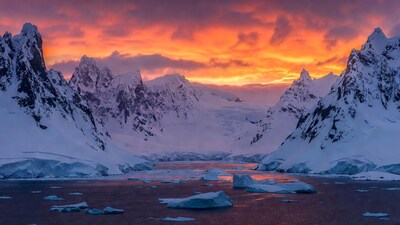 Antarctic Mountains and Iceberg Sunset