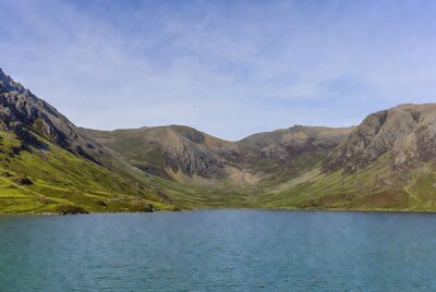 Mountain Lake Surrounded by Green Hills