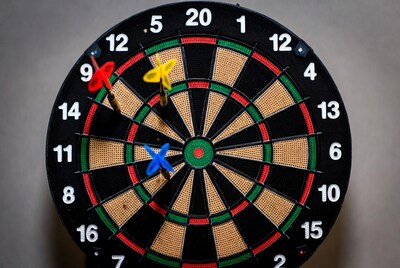 Dartboard with colorful darts