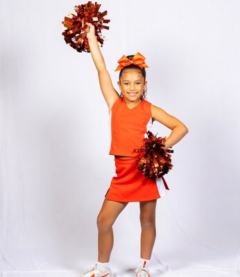 Latino girl cheerleader with pom poms