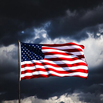 American flag waving in stormy sky