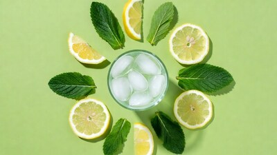Lemon Mint Ice Drink on Green Background