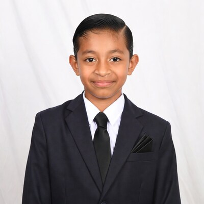 Young Asian boy in navy suit