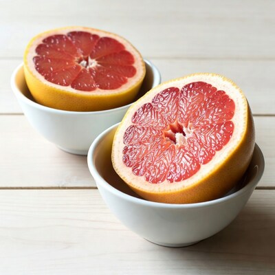 Halved Grapefruits in White Bowls