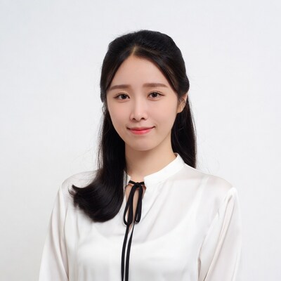 Asian woman in white blouse smiling