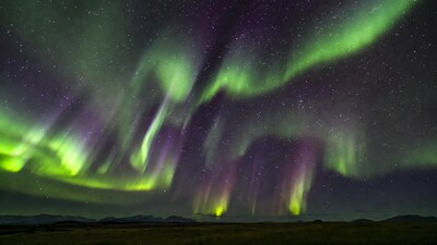 Vibrant Northern Lights over Grassland