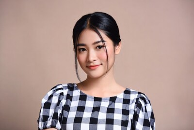 Asian woman in checkered blouse