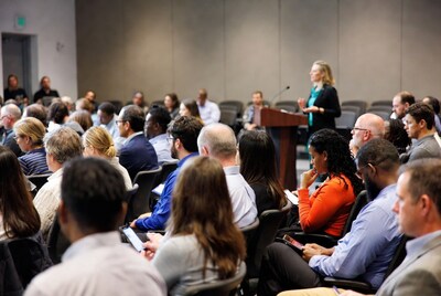 Woman speaking at conference podium