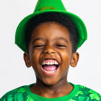 African-American boy laughing in leprechaun hat