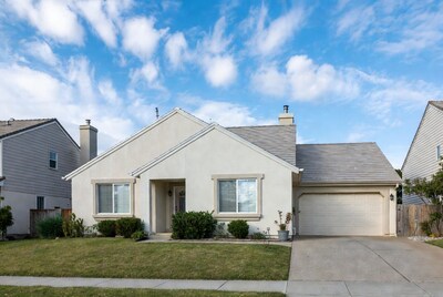 Beige stucco house with garage
