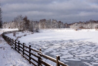 Snowy Fence by Frozen Lake