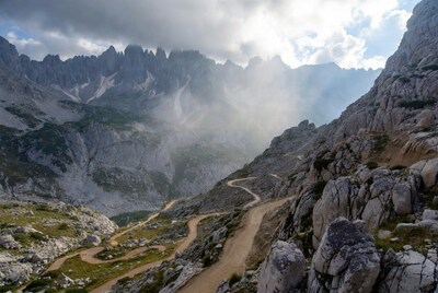 Winding mountain road in rocky valley