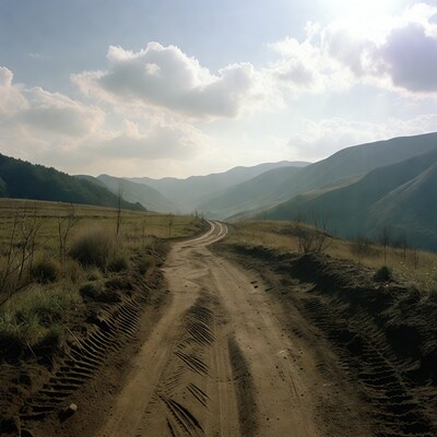 Dirt road through mountain valley