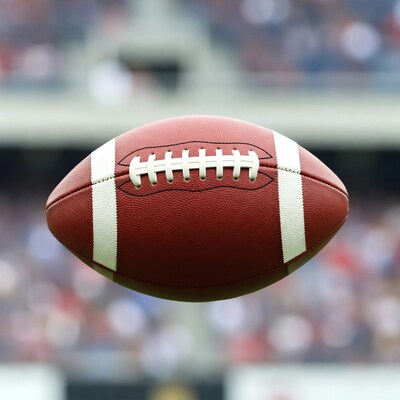 Football hovering over stadium crowd