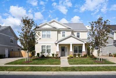 Beige Craftsman House with Landscaping