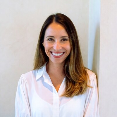 Smiling woman in white blouse