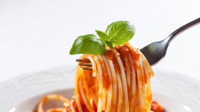 Spaghetti with tomato sauce on fork