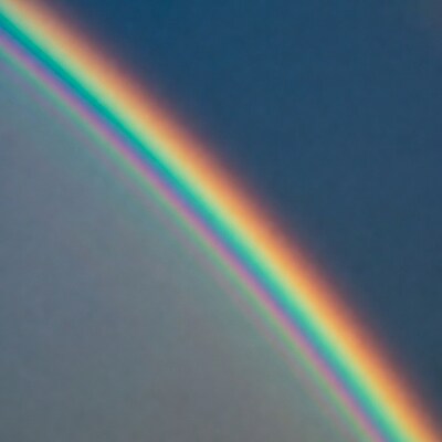 Vibrant Rainbow in Blue Sky