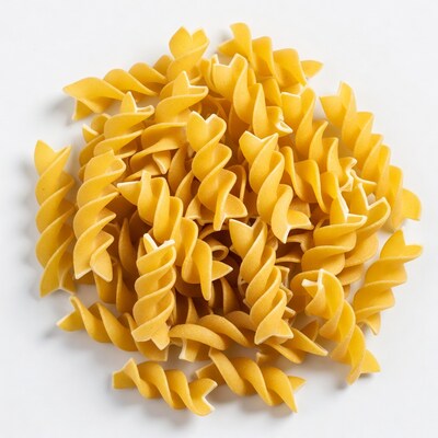 Pile of uncooked rotini pasta
