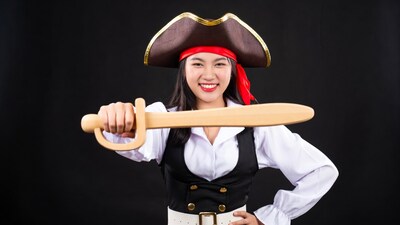 Asian woman pirate holding wooden sword