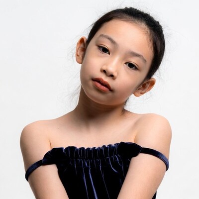 Asian girl in off-shoulder dress
