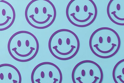 Purple Smiley Faces on Blue Background