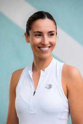 Smiling woman in white athletic tank top