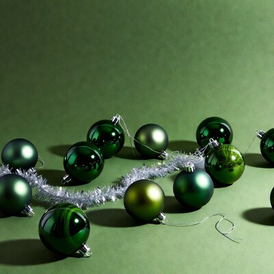 Green Christmas Ornaments on Green Background