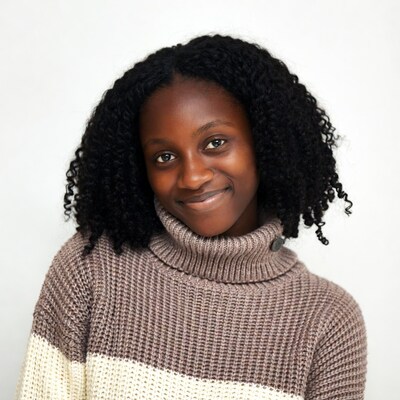 African-American girl smiling in turtleneck sweater