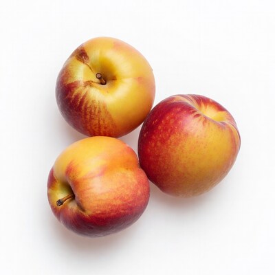 Fresh peaches on white background
