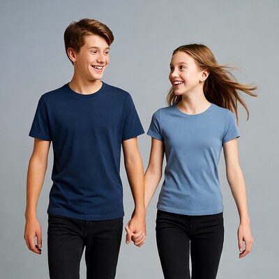 Teen boy and girl holding hands smiling