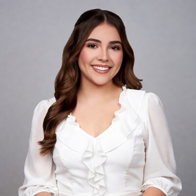 Smiling Latina woman in white ruffled blouse