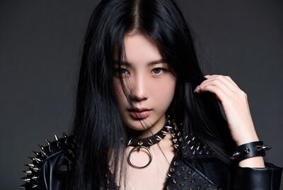 Asian woman in spiked leather jacket