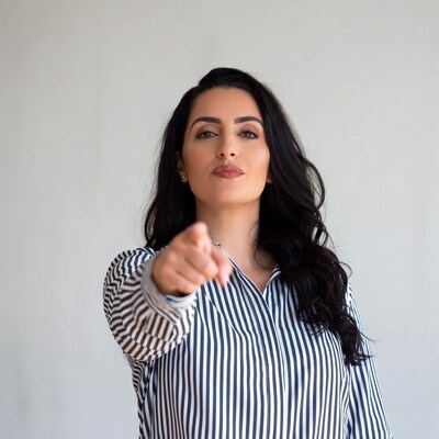 Woman pointing at viewer