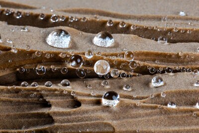 Water droplets on textured sand