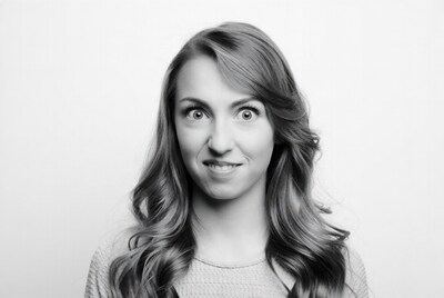 Woman with wide eyes smiling