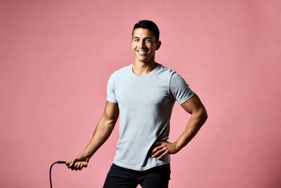 Muscular man holding jump rope