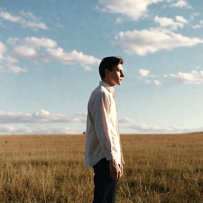 Man in white shirt in field